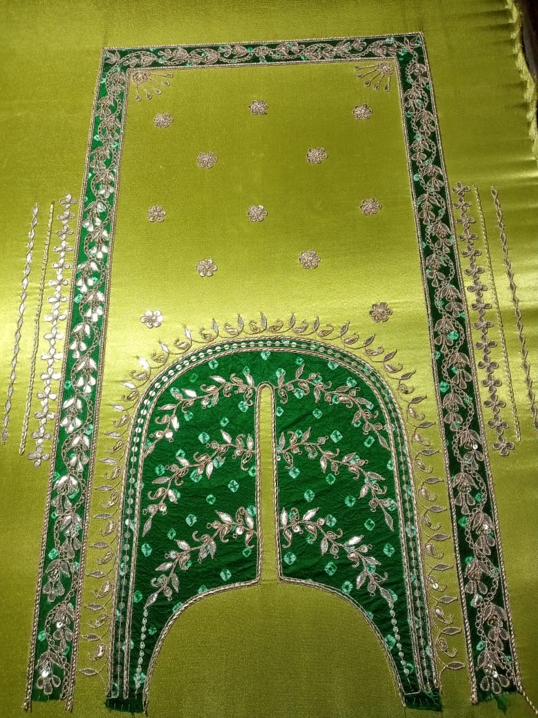 A bold lime and green combination, framed with metallic floral details.