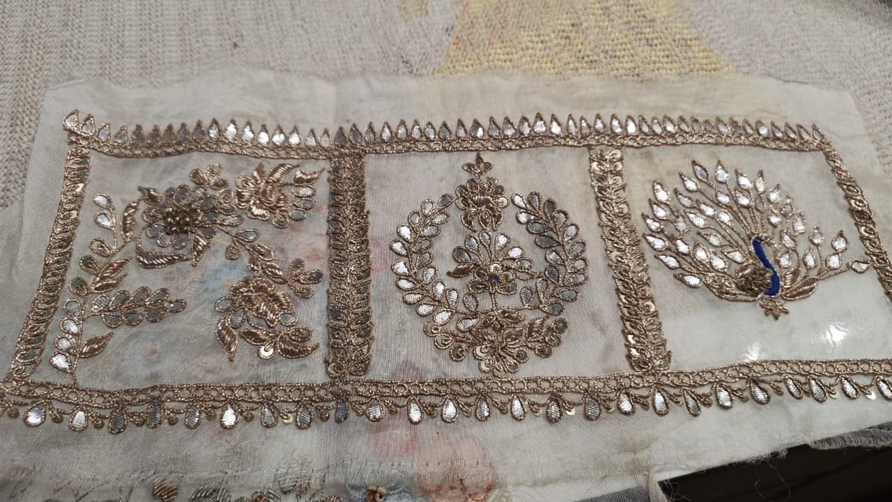 A repeating border of floral medallions with a narrow decorative edge.