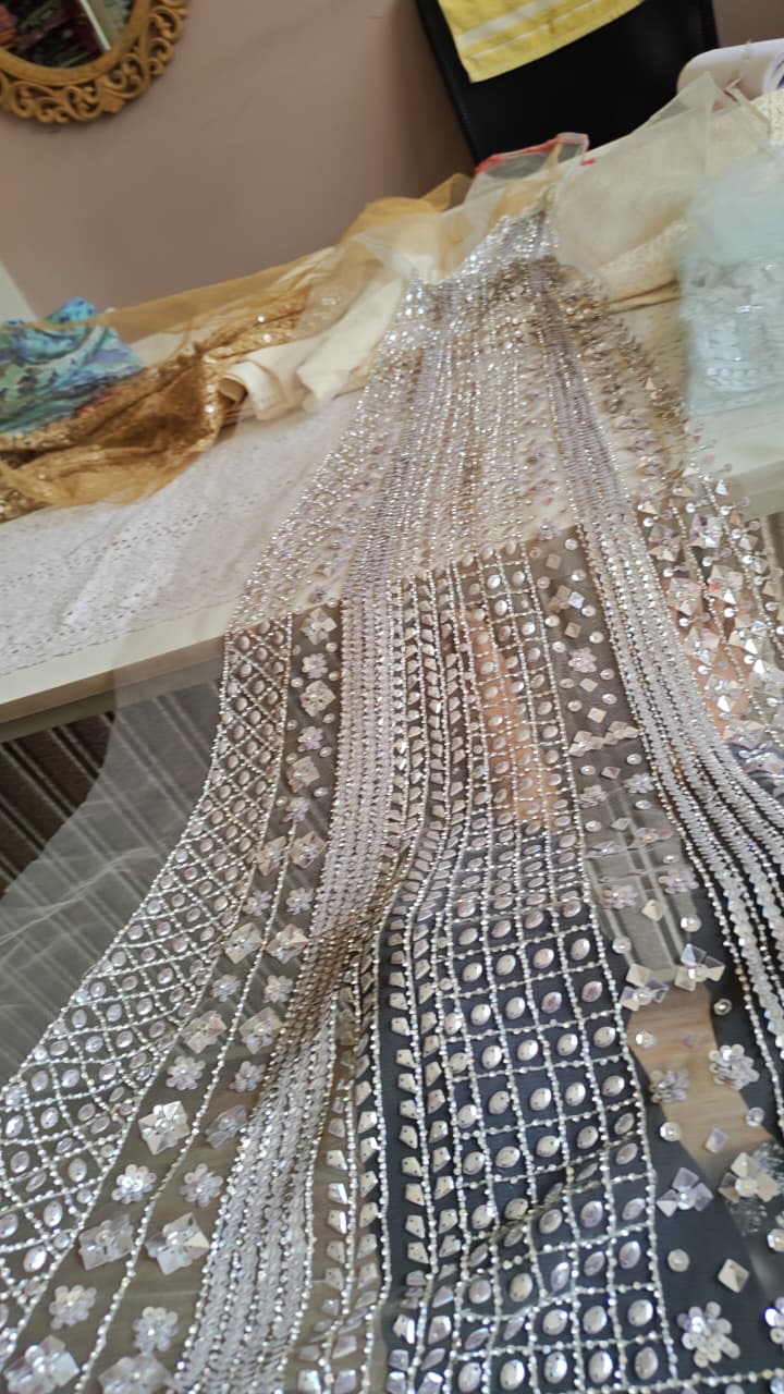 A second view of layered borders and long lines of reflective embellishment.