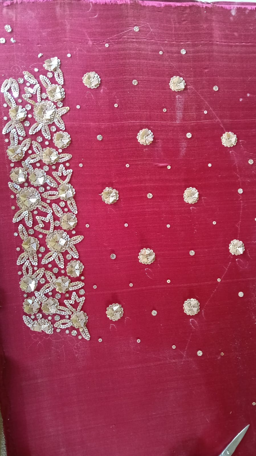 A vivid pink panel combining a large floral accent with smaller repeated motifs.