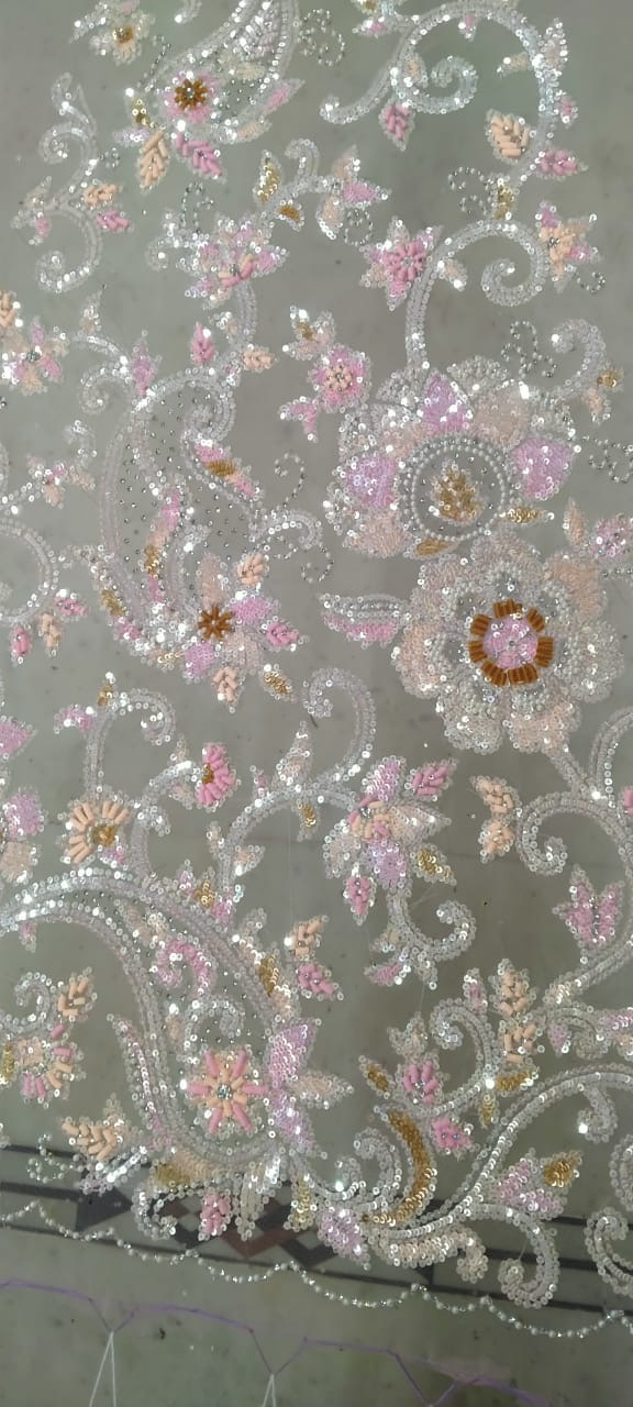 Pastel pink, green and metallic floral details on sheer net fabric.