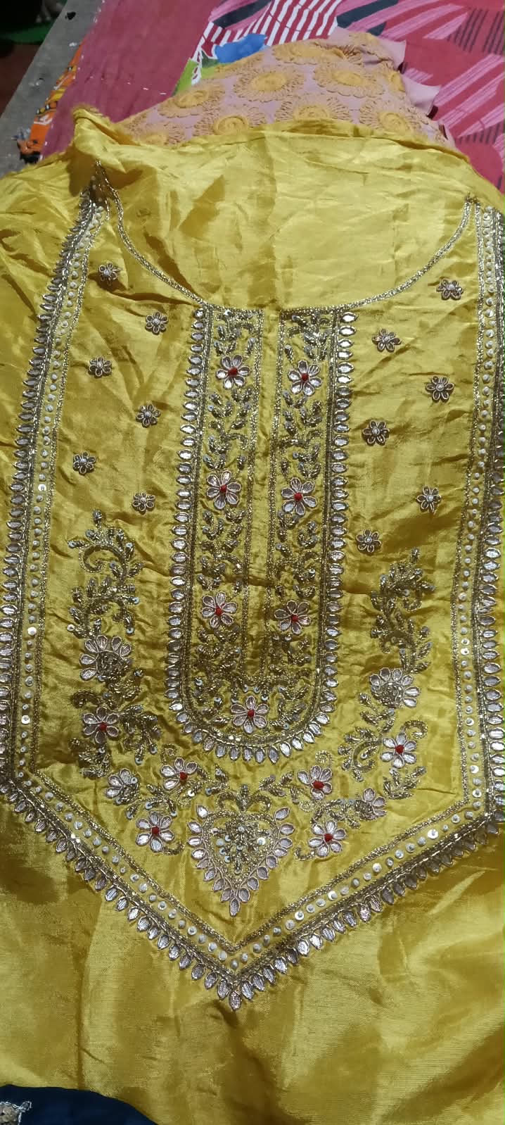A bright lime garment panel with an ornate, elongated neckline.