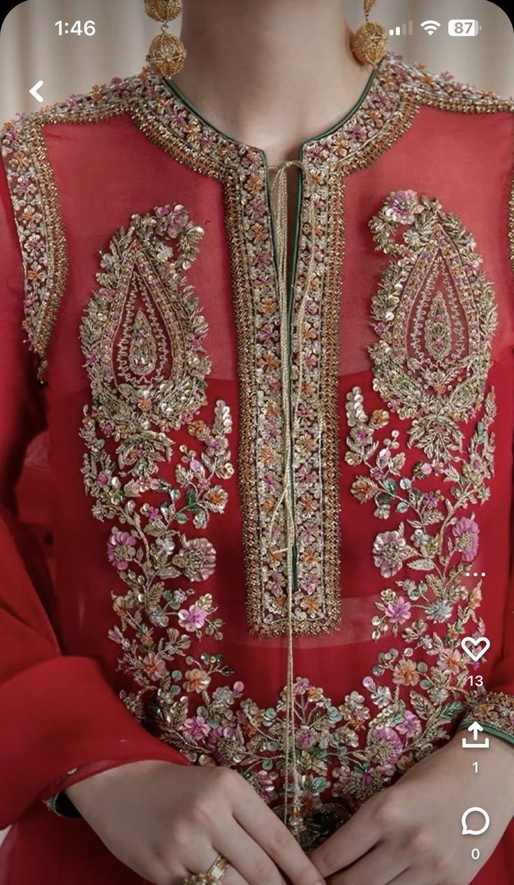 A design reference for a red outfit with detailed gold-toned embellishment.