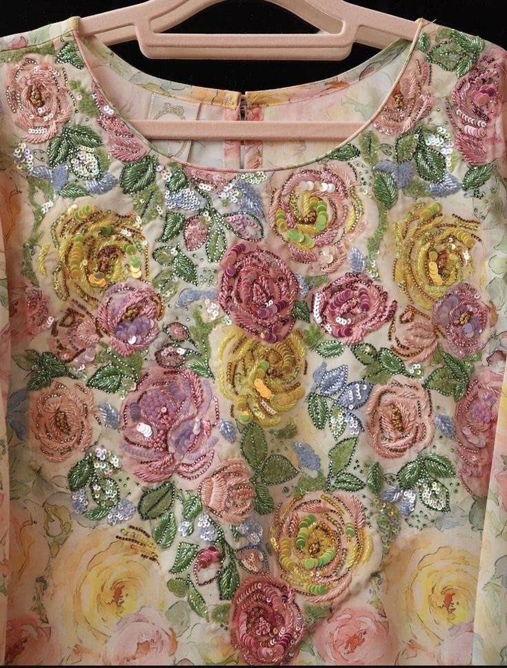 A garment reference covered with multicoloured floral motifs.